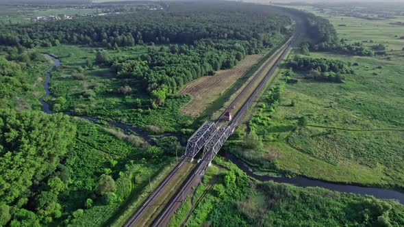 Railway Bridge in Countryside Passing Above Small River