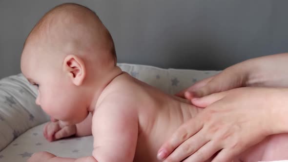 Mother Giving Massage To Little Child