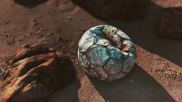 Old Leather Soccer Ball Abandoned on Sand