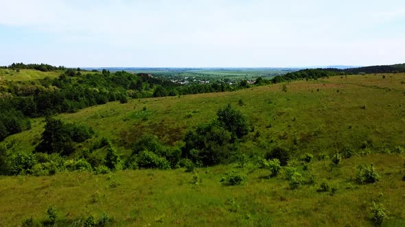 Aerial drone view of a flying over the rural agricultural landscape.