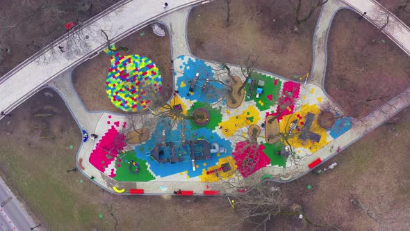 Children's Colourful Outside Playground with Carousels Swings and Slides