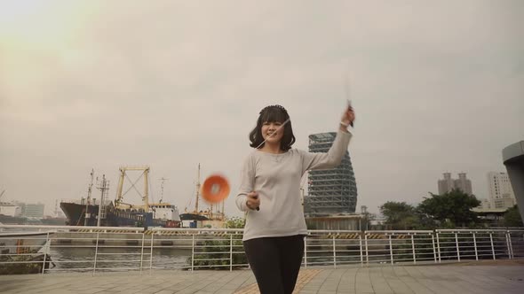 Taiwanese woman playing with a Chinese Yo-Yo