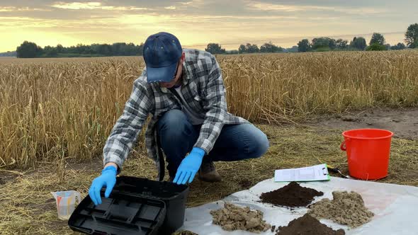 Agronomist Preparing Soil Analysis Pouring Soil Sample Flask Outdoors