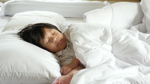 Cute Asian Child Sleeping On White Bed With Mother Care Slow Motion