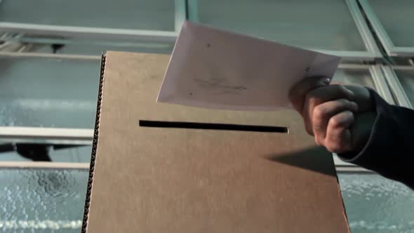 Ballot Box with Person Casting Vote on Blank Voting Slip. 4K Version.