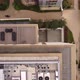 View From a Drone on the Roof of Multistorey Buildings Surrounded By Trees - VideoHive Item for Sale