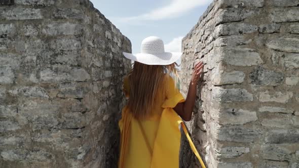 Girl In Yellow Dress Walking On Mayan Ruin Temple Belize