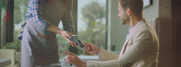 Man using credit card for paying bill