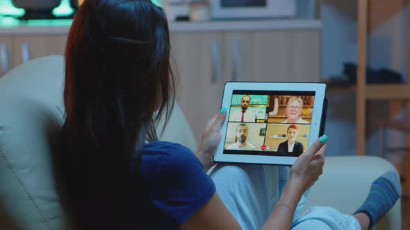 Freelancer Using Tablet for Video Conference