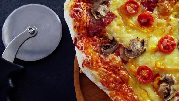 Baked pizza on wooden board