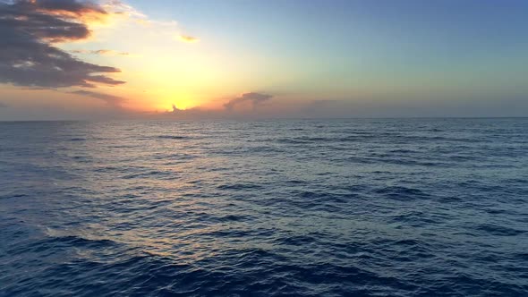 Sunset at Waving Sea. Aerial Shot