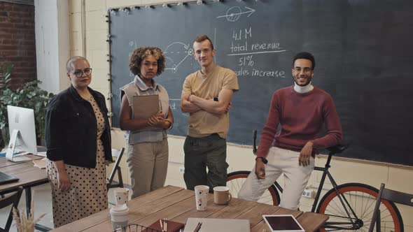 Young Diverse Employees Posing in Office