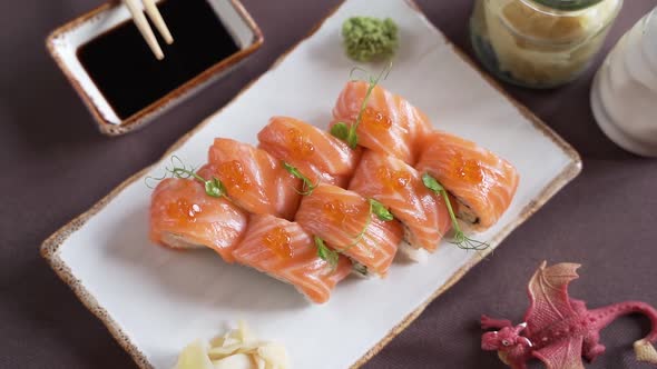 Sushi set with salmon and red caviar, beautifully presented on the table