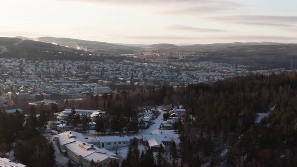 An aerial view of Sundsvall's Forest and Houses at Morning light.