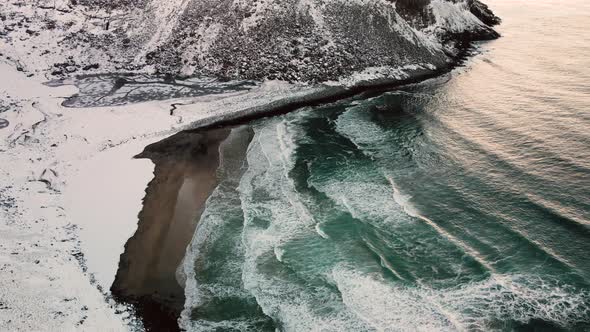 Waves Splashing At Kvalvika Beach During Wintertime. Tourist Destination By Vestervika Bay In Norway