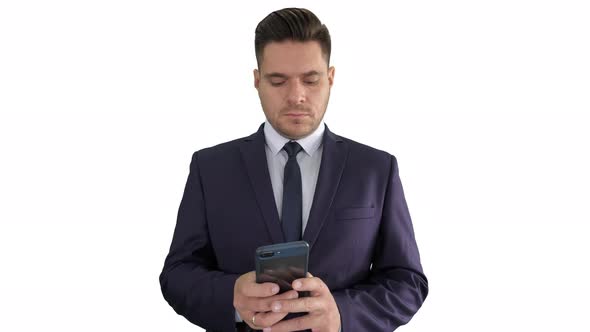 Serious Businessman Texting Message on His Phone on White Background