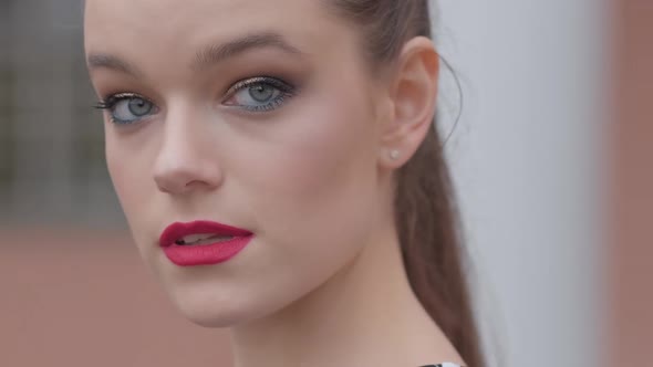 Portrait of Young Brunette Woman Looking at Camera. Beautiful Fashionable Model