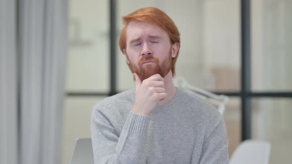Portrait of Pensive Young Redhead Man Thinking