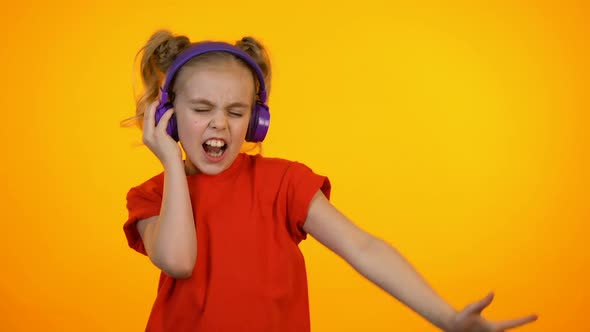 Adorable Girl Listening to Music in Earphones and Dancing, Favorite Song, Dream