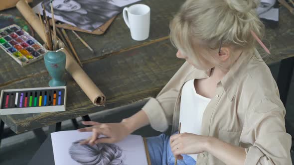 Young Artist Woman Working with Pencil Drawing at The Workplace