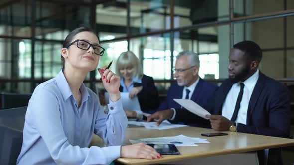 Female Company Employee Dreaming of Vacations in Office Reading News on Tablet