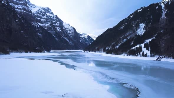 Beautiful valley in Switzerland with a icey lake.Cameraes forward.
