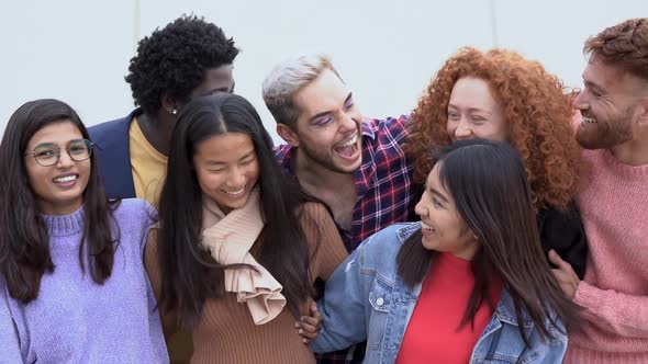 Group of young multiracial people having fun in the city - Diverse friends outdoor