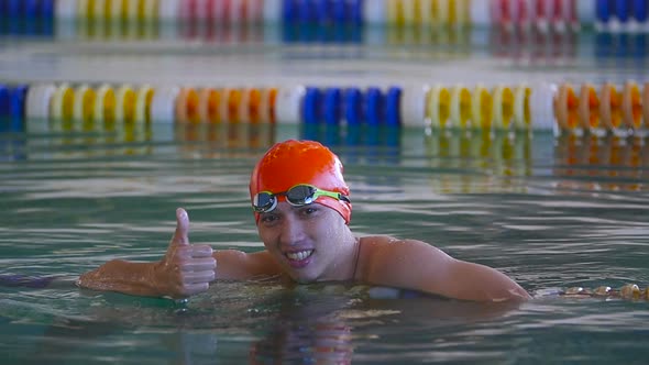 Swimmer Taking Rest And Thumb Up