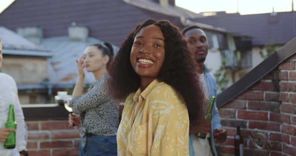 Girl which Looking at Camera with Satisfied Face Near Her Positive Carefree Multiracial Friends