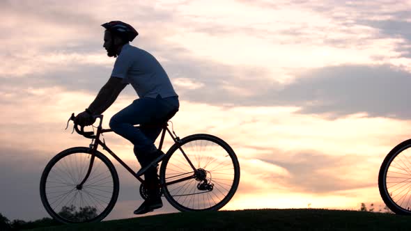 Young People Riding Bicycles at Sunset