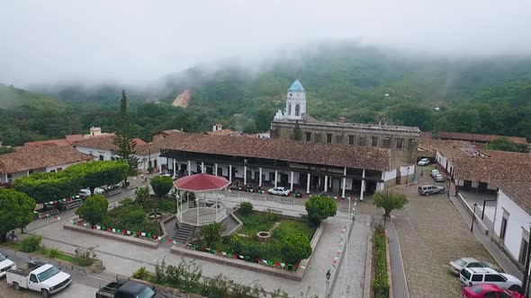 Traditional Square in Mexico with Fog in the Background