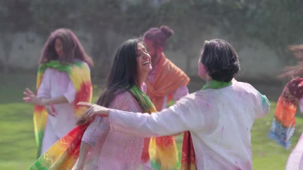 Indian people wishing happy Holi and dancing