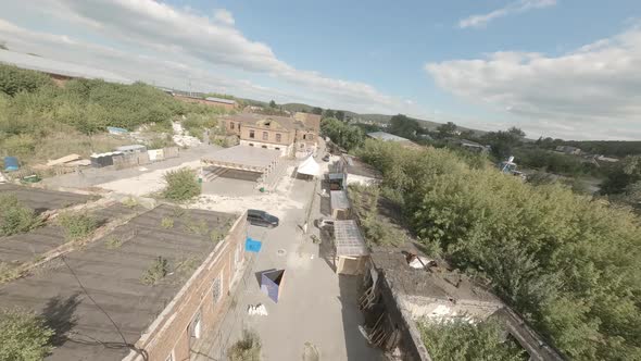 FPV drone view of old ruined factory for events 02