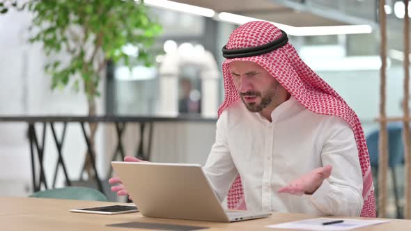 Loss Arab Businessman Reacting to Failure on Laptop