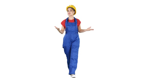 Cheerful female construction worker talking to camera on