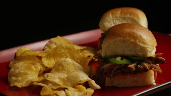 Rotating shot of delicious pulled pork sliders - BBQ 