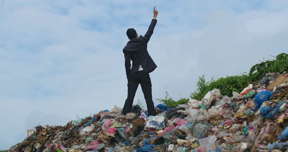 Businessman Winner On Garbage Pile