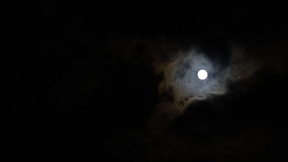 Clouds passing by moon at night. Full moon at night with cloud real time. mystery fairyland scene.