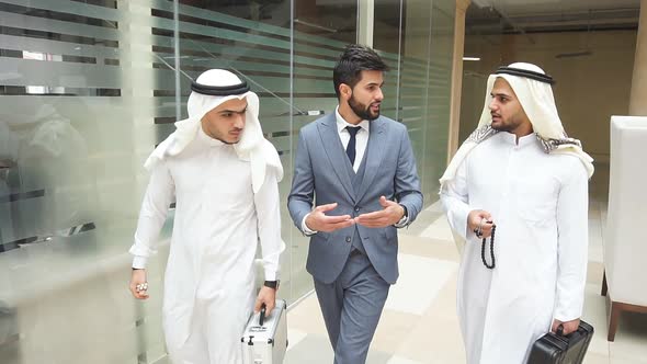 Sheikhs and European Businessman Have Conversation After Making a Deal.