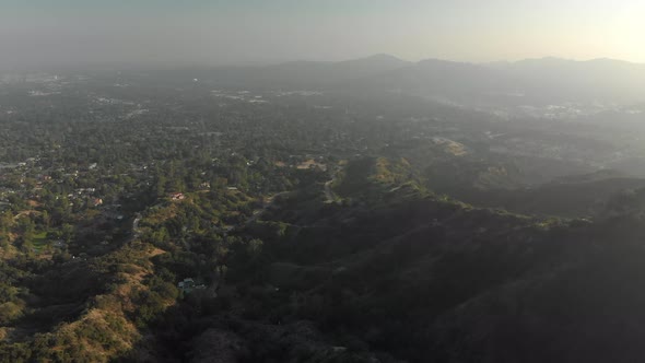 Aerial of Verdant Foothills Over Hazy Valley