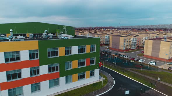 Bright Color Building with Parking Lots and Playground