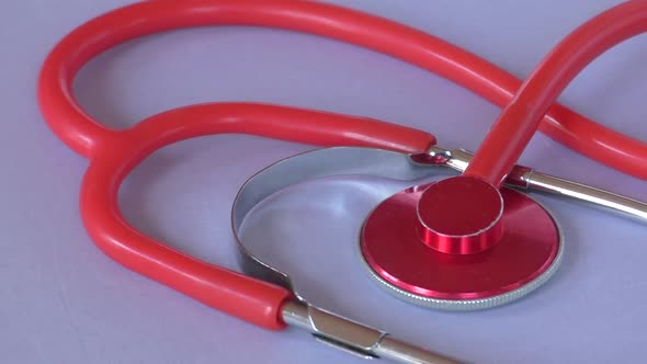 A red medical stethoscope. 