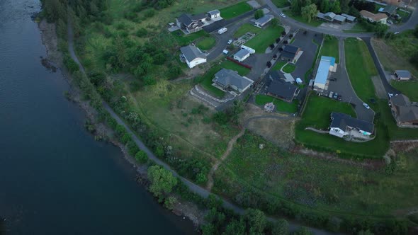 Top down aerial shot of upper class homes perched over the Spokane River.