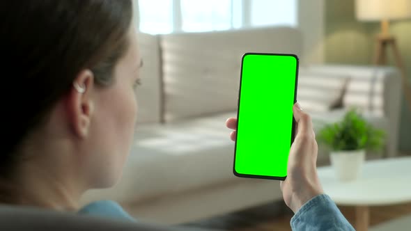 POV View of Woman at Phone with Green Screen for Copy Space. Chromakey Mock Up Without Tracking