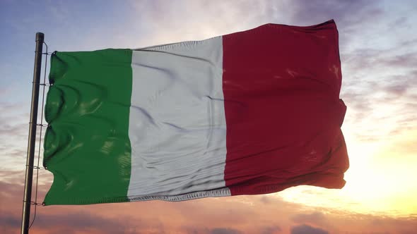 Flag of Italy Waving in the Wind Against Deep Beautiful Sky at Sunset