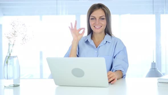 Portrait of Beautiful Young Woman Gesturing  Okay Sign