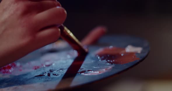 Artist Mixes Paints On The Palette