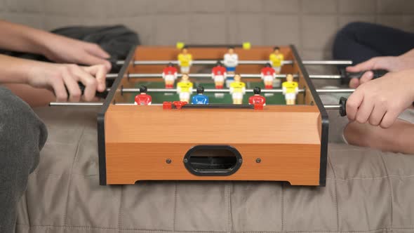 Friends Play Table Football