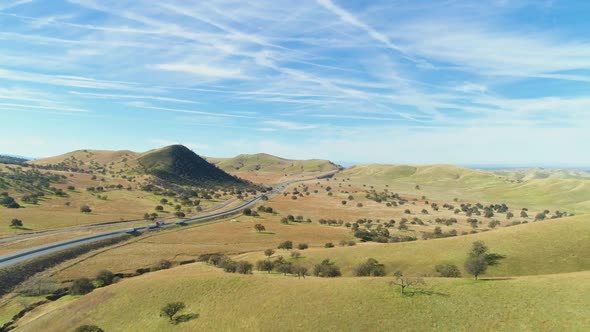 Highway and Hilly Rural Landscape. Kern County. California, USA. Aerial View