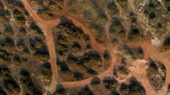 Wide aerial shot of two Four Wheelers racing on the winding trails of Cavo Greko